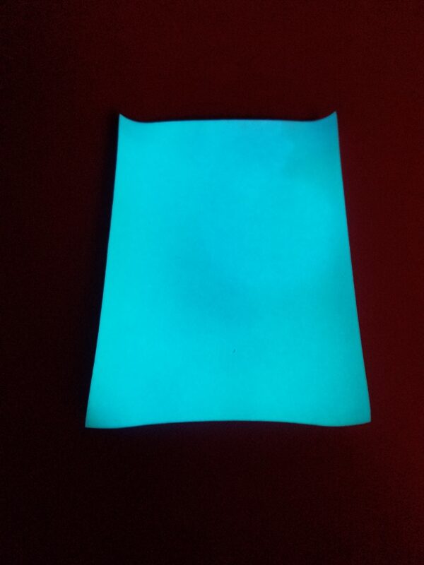 Charged Atomic Glow in Blue