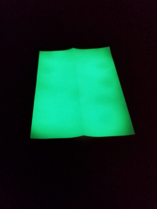 Charged Atomic Glow in Green